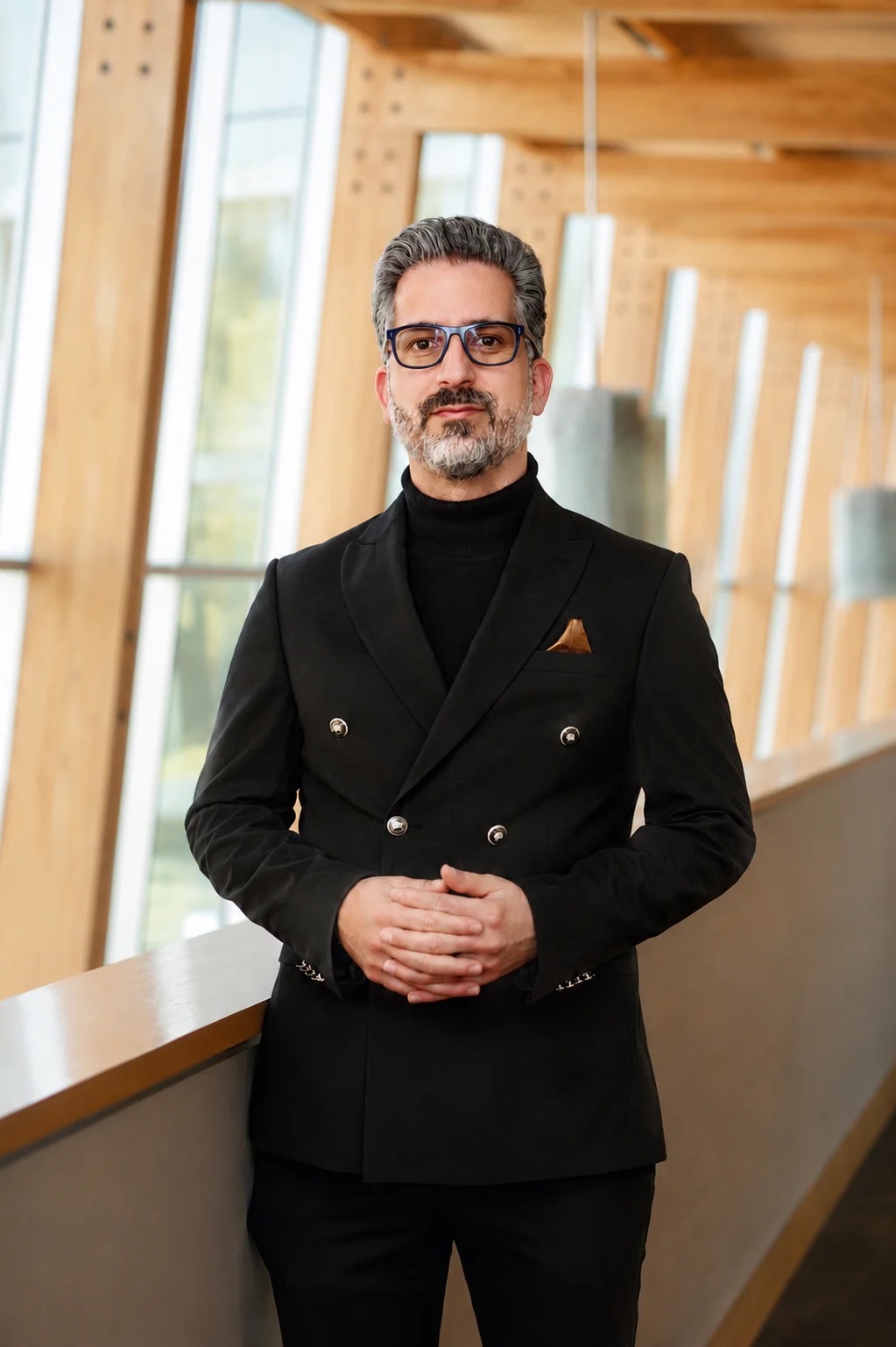 Ali Inanloo in a tailored black suit